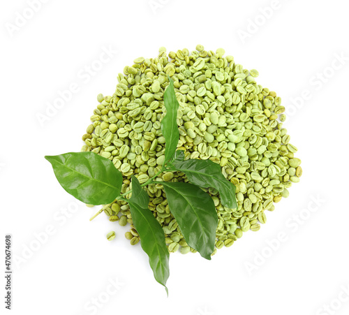 Green coffee beans and fresh leaves on white background  top view