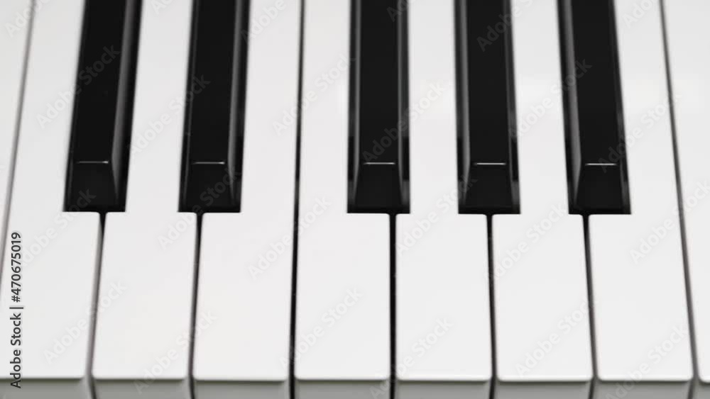 Panning shot across piano keyboard Panning shot across piano keyboard