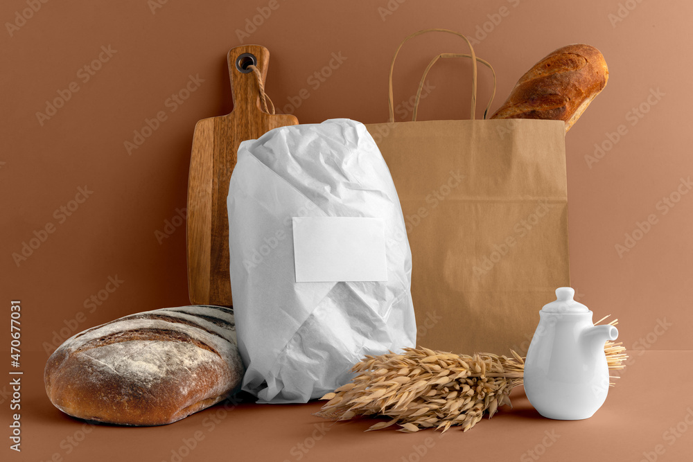 Blank wrapped paper bread with bag, board, bakery branding mockup, empty space to display your logo or design. Blank wrapped paper bread with bag, board, bakery branding mockup, empty space to display your logo or design.