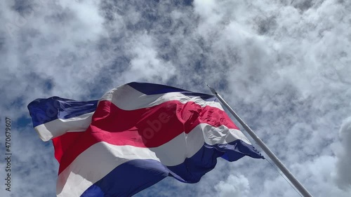 Costa Rica's flag. View from below of the Costa Rican flag waving on a flagpole.
