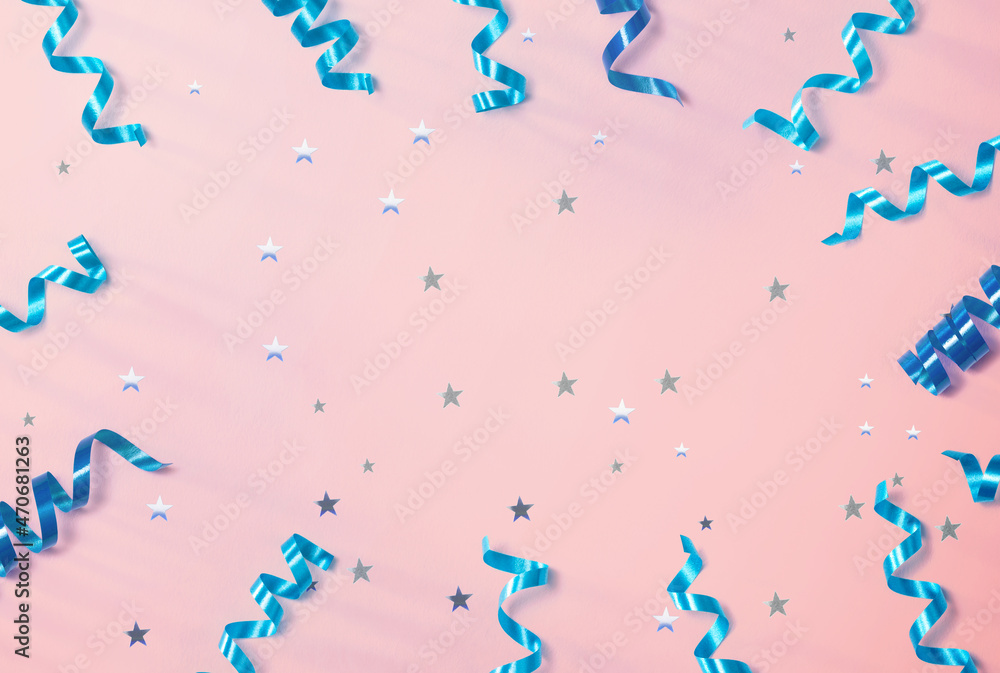 Blue curly ribbons with star confetti - flat lay Blue curly ribbons with star confetti - flat lay