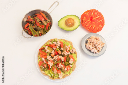 Mexican food- integral fajita with tuna, pepper, tomato and avocado - tradicional plate of México.