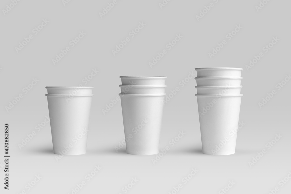 Blank paper coffee cups on a white background, packaging mockup with empty space to display your branding design. Blank paper coffee cups on a white background, packaging mockup with empty space to display your branding design.