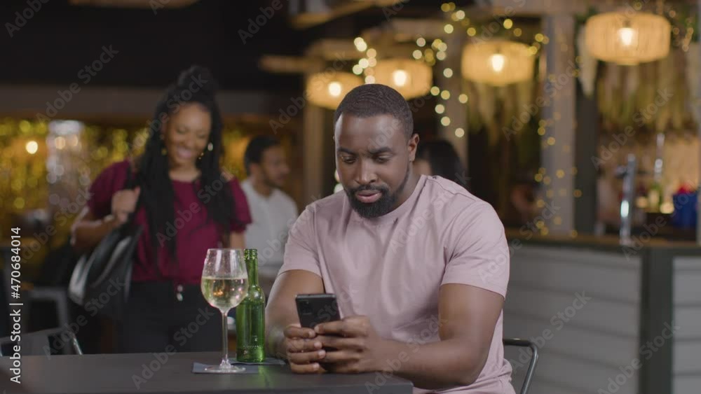 Sliding Shot of a Woman Joining a Man In a Bar Sliding Shot of a Woman Joining a Man In a Bar