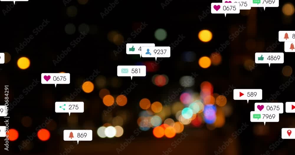 Animation of social media icons and numbers over out of focus city and car lights Animation of social media icons and numbers over out of focus city and car lights