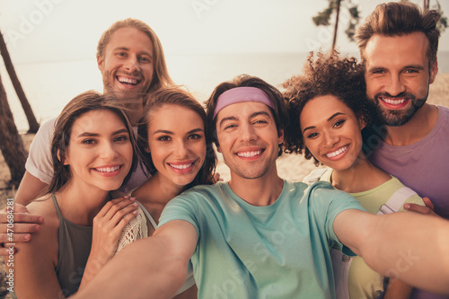 Photo of pretty charming diversity group dressed casual outfits smiling embracing tacking selfie outdoors countryside