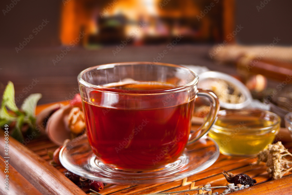 Cup of herbal mint tea with dry herbs on the tray. Cup of herbal mint tea with dry herbs on the tray.