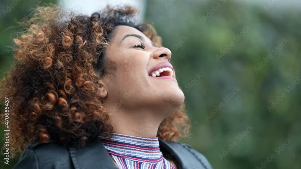 Ecstatic woman feeling happy looking at sky. Joyful person with HOPE Ecstatic woman feeling happy looking at sky. Joyful person with HOPE