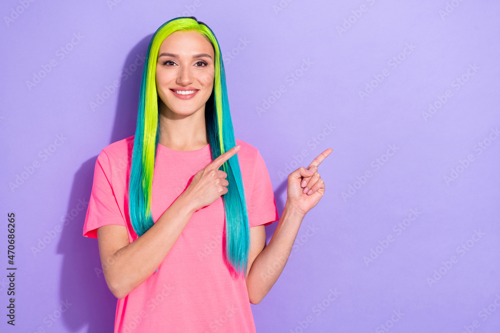 Photo of positive teal blue haired lady promoter point finger empty space suggest select ad isolated over violet color background Photo of positive teal blue haired lady promoter point finger empty space suggest select ad isolated over violet color background