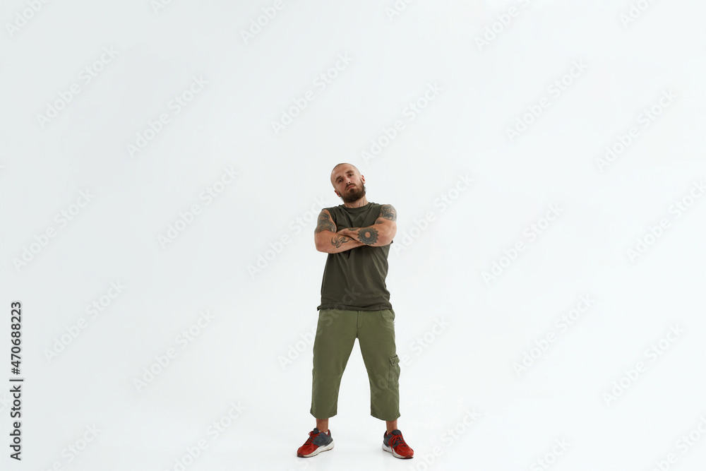 Bald confident caucasian man with crossed arms Bald confident caucasian man with crossed arms