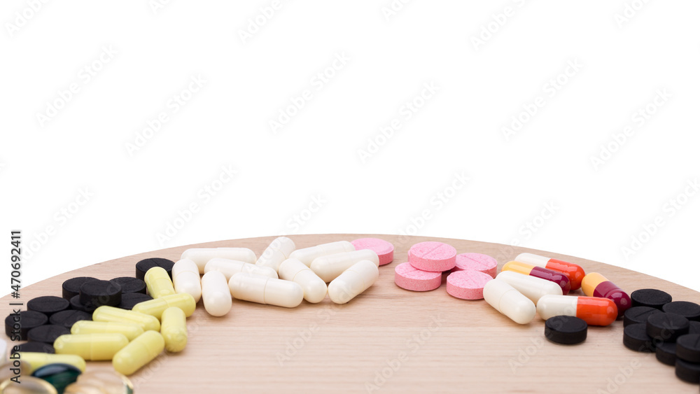 Assorted pharmaceutical medicine pills, tablets and capsules over blue background Assorted pharmaceutical medicine pills, tablets and capsules over blue background