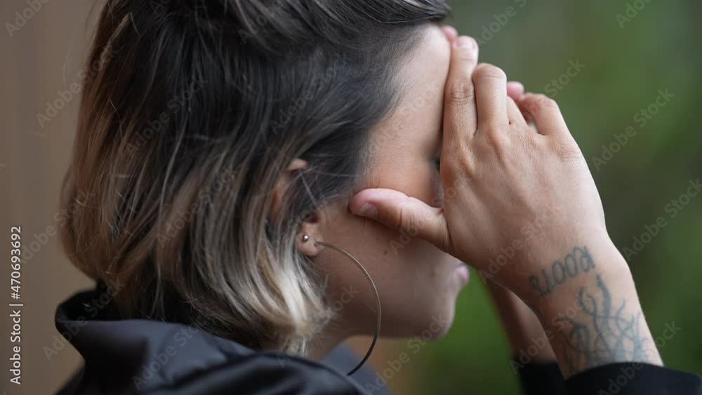 Person covering face with hands feeling ashamed. Woman in despair and depression Person covering face with hands feeling ashamed. Woman in despair and depression