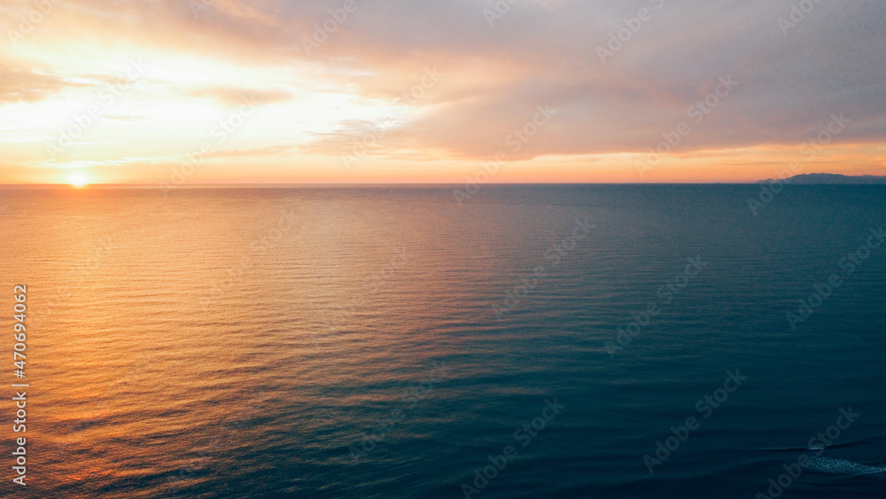 Beautiful sunset over sea, aerial view. Evening seascape, drone photography.