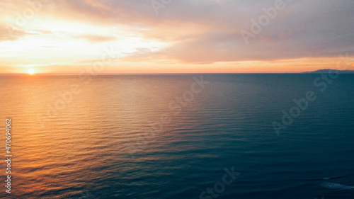 Beautiful sunset over sea, aerial view. Evening seascape, drone photography.