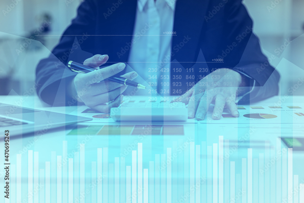 Two businessmen are meeting together, they are looking at a graph diagram on a tablet showing a chart of the company's financial status. Concept of business administration and finance. Two businessmen are meeting together, they are looking at a graph diagram on a tablet showing a chart of the company's financial status. Concept of business administration and finance.