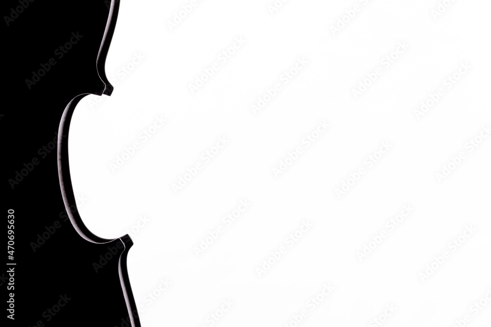 A sihouette of a part of a violin or a viola on a white background A sihouette of a part of a violin or a viola on a white background