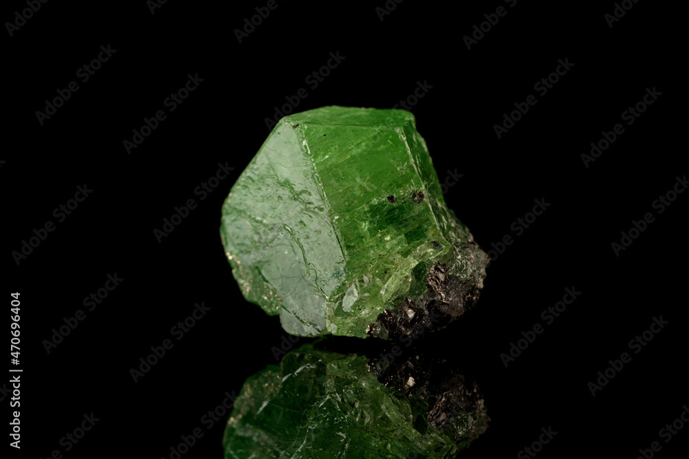 macro mineral stone Demantoid on a black background macro mineral stone Demantoid on a black background