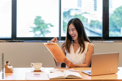Asian businesswoman in casual suit are glad when looking the revenue in target in modern office, business and lifestyle concept Free Download Asian businesswoman in casual suit are glad when looking the revenue in target in modern office, business and lifestyle concept - GFXLoad