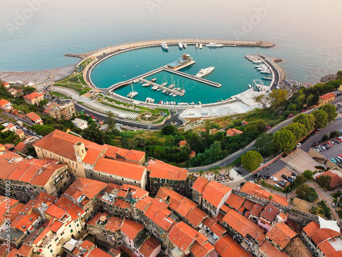 Aerial Drone of Cala Del Forte, new marina in Ventimiglia, Liguria, Italy owned by Monaco Ports. Beautiful panoramic aerial view from flying drone on Monaco Principality Third Port landmarks  photo