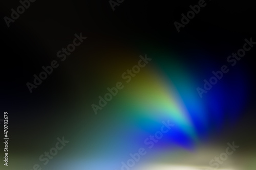 Curved colored rays blue, green, orange on a dark background.