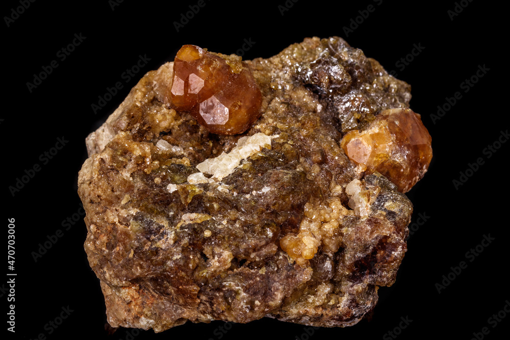 macro mineral stone Grossular, Garnet, Epidote on a black background macro mineral stone Grossular, Garnet, Epidote on a black background
