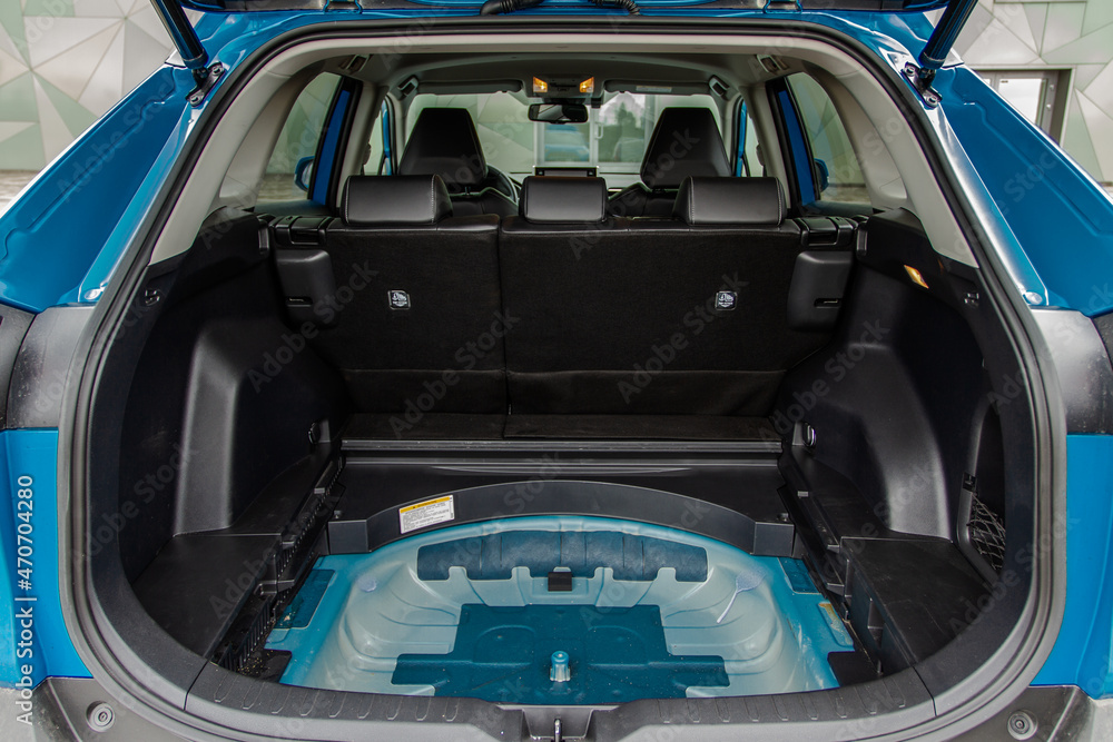 Huge, clean and empty car trunk in interior of compact suv. Rear view of a SUV car with open trunk