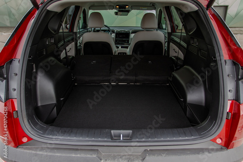 Huge, clean and empty car trunk in interior of compact suv. Rear view of a SUV car with open trunk