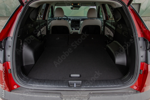 Huge, clean and empty car trunk in interior of compact suv. Rear view of a SUV car with open trunk