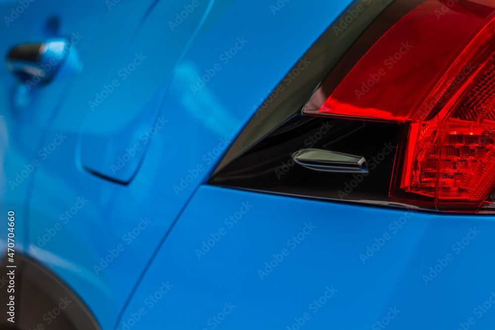 Fototapeta premium Modern rear light of a car. Brake light and arrow of large suv. Rear light of car close up view. Tail light.