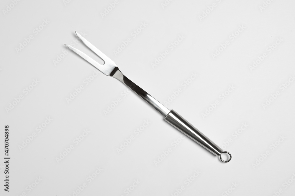 Big kitchen fork isolated on white background. High resolution photo.Top view.Mock up
