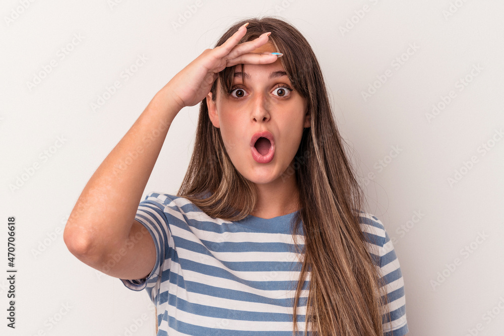 Young caucasian woman isolated on white background looking far away keeping hand on forehead. Young caucasian woman isolated on white background looking far away keeping hand on forehead.
