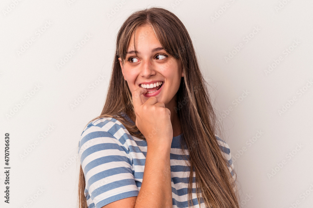 Young caucasian woman isolated on white background relaxed thinking about something looking at a copy space. Young caucasian woman isolated on white background relaxed thinking about something looking at a copy space.