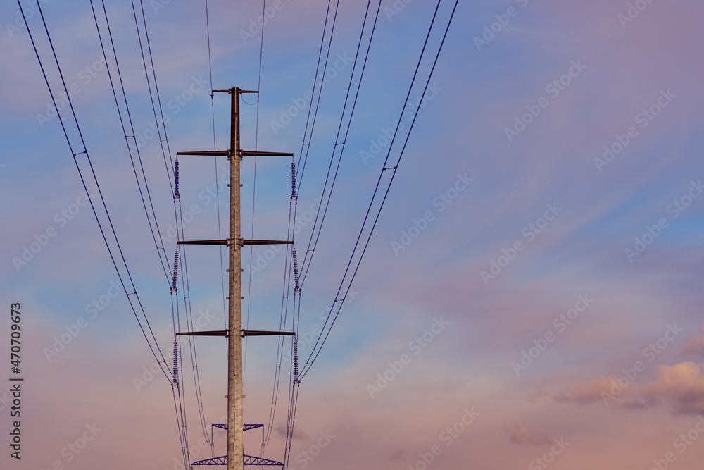 Electricity pylon against the sky. High - voltage power lines .