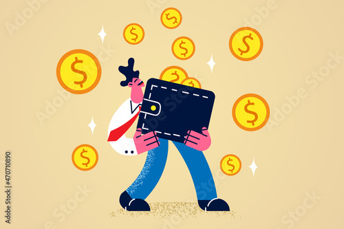 Happy businessman hold wallet full of money