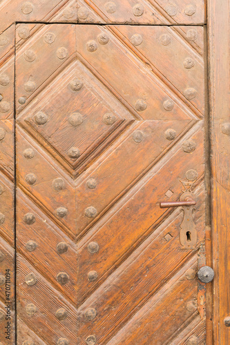 Old door with an interesting ornament, close-up.