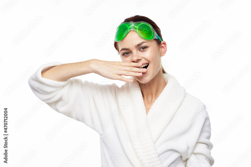 cheerful woman in a white robe facial care rejuvenation lifting cheerful woman in a white robe facial care rejuvenation lifting