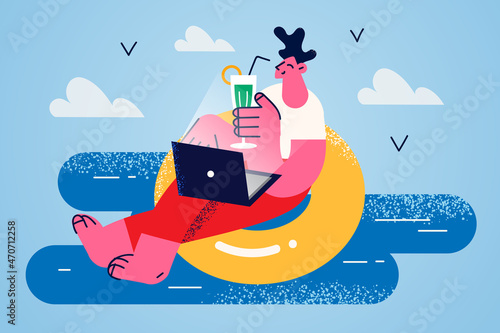 Happy man relax at sea working online on laptop 