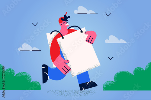 Smiling man with banner advertise product 
