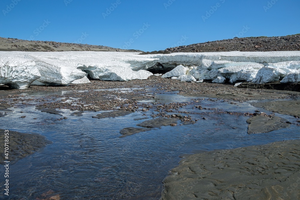 Melting glacier at the feet of Gorely volcano located in the southern part of Kamchatka Peninsula, Russia. Melting glacier at the feet of Gorely volcano located in the southern part of Kamchatka Peninsula, Russia.