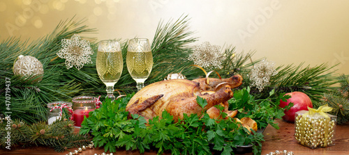 Christmas or Thanksgiving. Baked chicken stuffed with apples for Christmas dinner on the festive table.
