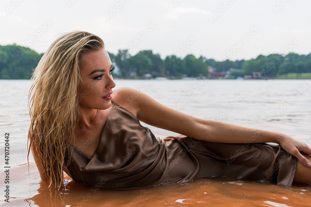 A Lovely Blonde Model Enjoys A Day At The Lake