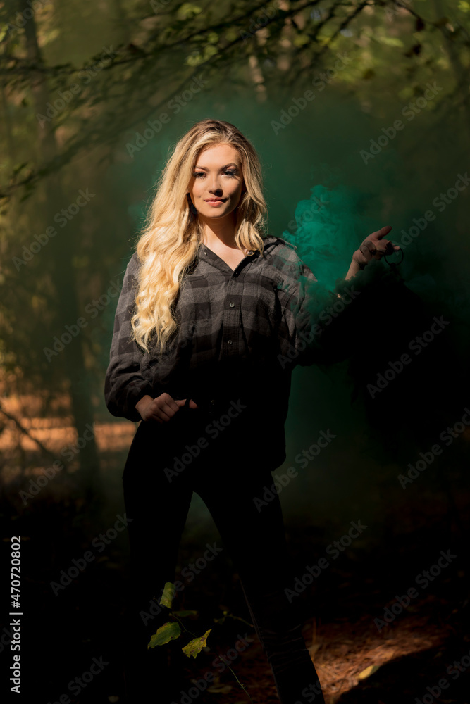 A Lovely Blonde Model Holds A Lantern With Smoke Flowing Out Of It In A Moody Forrest Environment