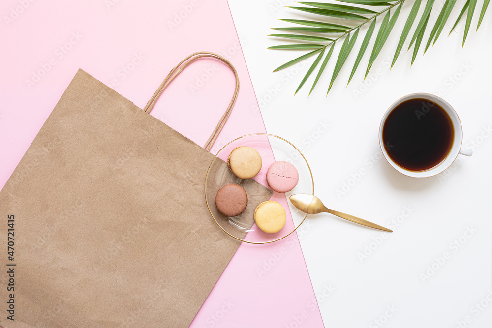 Flat Lay shopping concept with paper bag and tropical leaves. Elegant composition with elegant accessories. Flat Lay shopping concept with paper bag and tropical leaves. Elegant composition with elegant accessories.