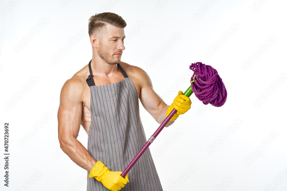 sporty man in apron mop posing cleaning housework sporty man in apron mop posing cleaning housework