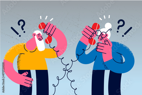 Old man and woman have connection problems talking on phone 