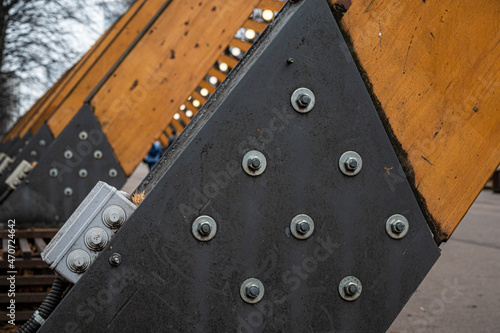 Elements of metal fasteners on wooden supports