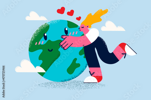 Woman hug kiss planet earth take care of environment 
