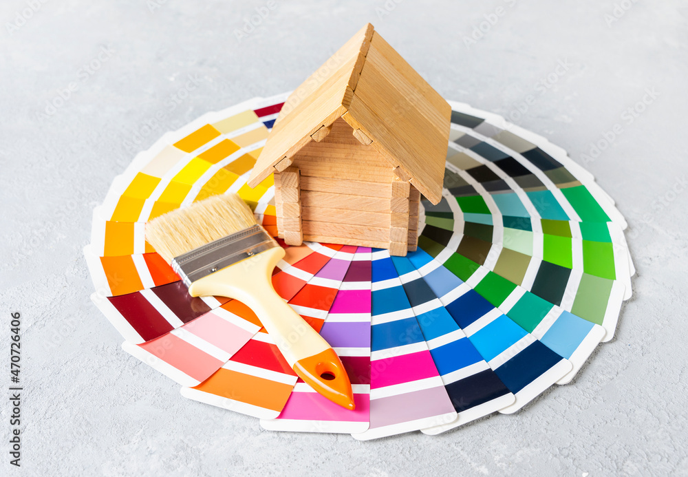 Painting the house or house renovation concept with little wooden house