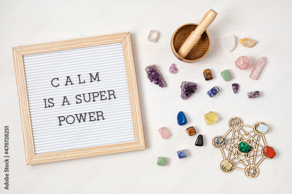 Letter board with motivation text calm is a super power. Gemstones, crystals for megitation and relax. Natural elements for cleansing negative energy, adding positive vibes. Mental health and balance 
