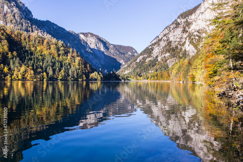 Idyllic mountain lake Leopoldsteinersee surrounded by mountains in Austria in the morning during autumn